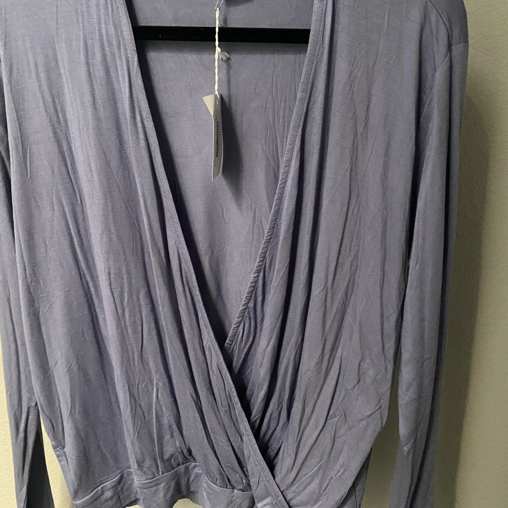 Long sleeve wrap tee. New with tags. Never worn.